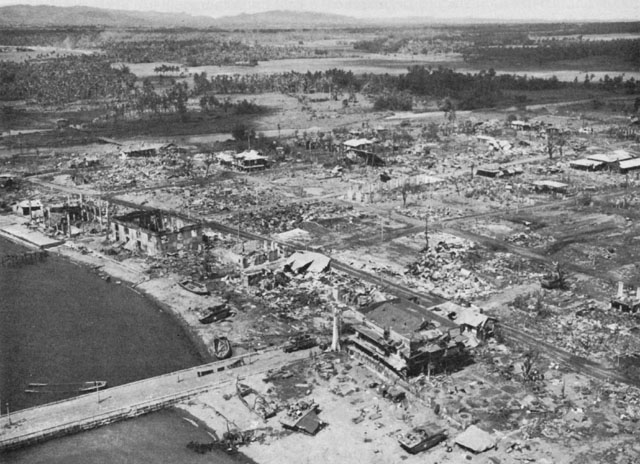 AERIAL VIEW OF ORMOC after the bombardment. In the middle background is the Antilao River, with the mountains of western Ormoc Valley in the distance.