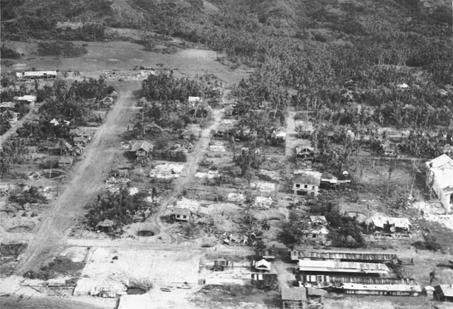 PALOMPON AFTER ALLIED BOMBINGS. Note bomb craters in foreground.