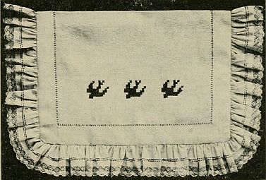 photo: ruffled lace pocket with swallows embroidered on