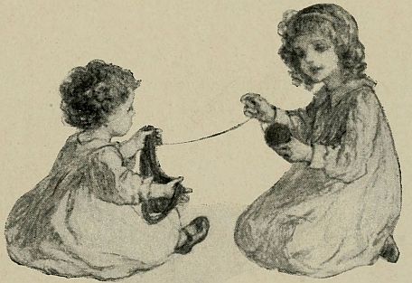 one little girl winding a ball of yarn that another littler girl is holding up for her