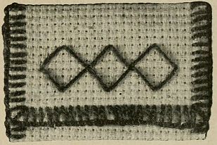 diamond pattern stitched on what looks like aida cloth