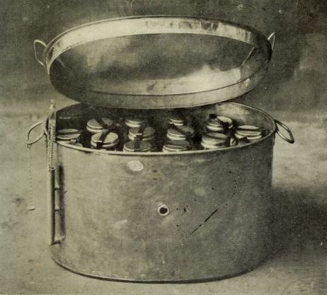 photograph: cannter full of jars, sort looks like a pressure cooker
