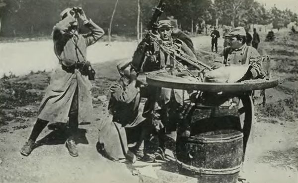 French Using an Ordinary Wine Barrel on which a Wagon Wheel Is Mounted to Facilitate the Revolving Movement to Any Desired Direction