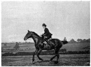 Woman riding at the canter