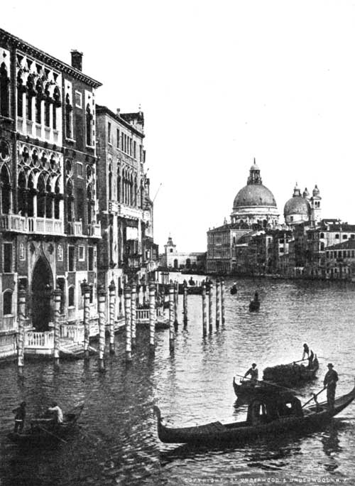 The Grand Canal, Venice. Notice the mooring-posts and the black gondola.  