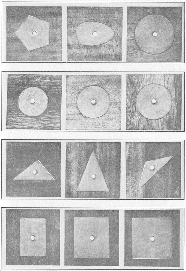 A FEW OF THE MANY GEOMETRIC INSETS OF WOOD USED TO TEACH FORM