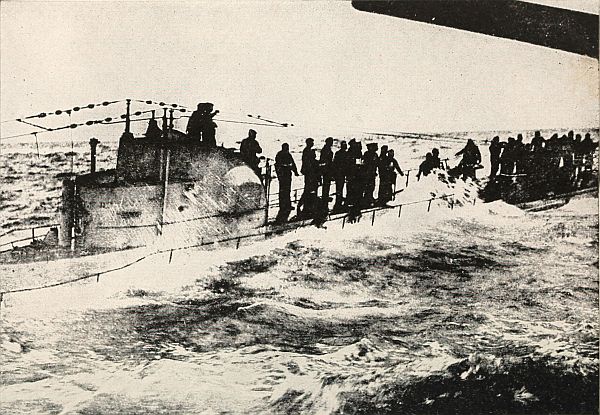men standing on German submarine in the water