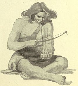 man using bow drill