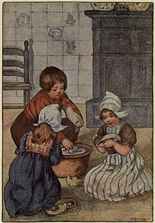 four children sitting on floor