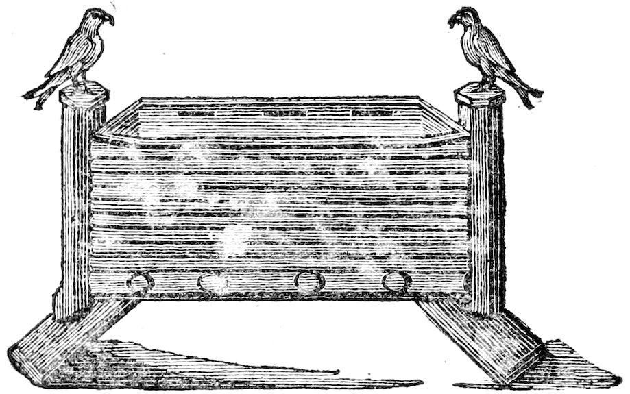 Black-and-white engraving of a rectangular cradle with horizontal banding, set between two fluted columns. A bird perches on top of each column. Four round openings appear along the lower front of the cradle. The base extends outward on both sides.
