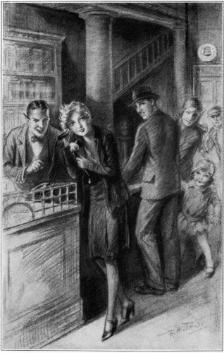 Nancy at the Clerk’s desk, using the phone.