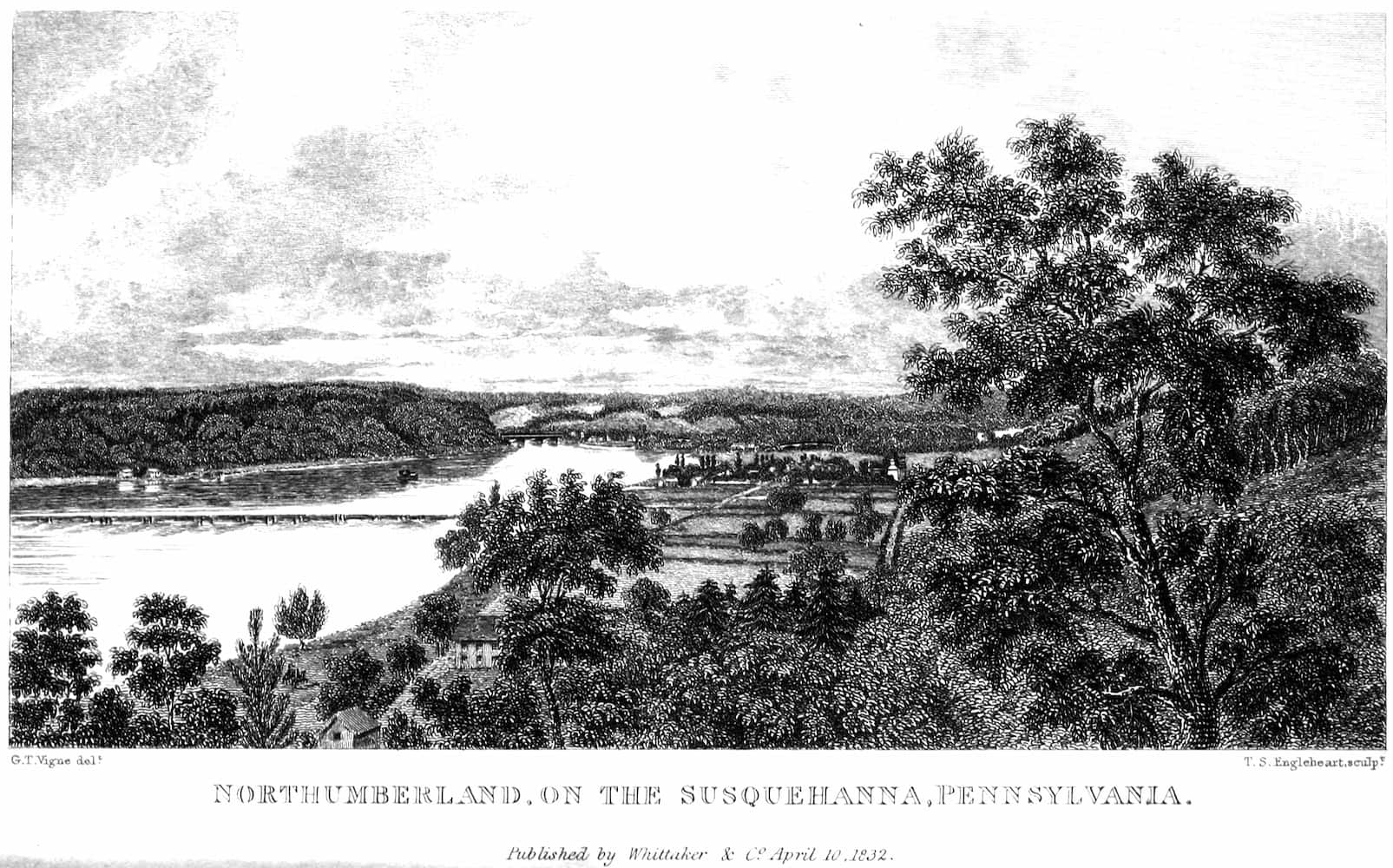 View of a river from afar near trees and some fields.