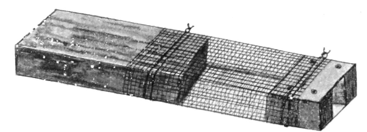 A small box. A small enterince at one end. A section in the middle is made of fine wire mesh.