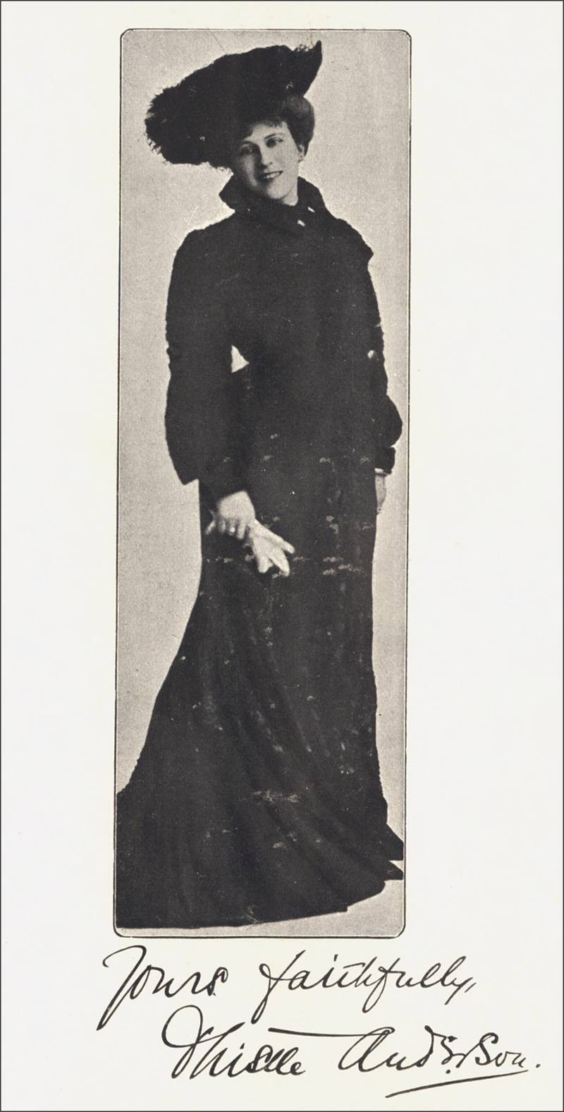 Autographed     photo of the author posing, dressed in long sweeping dress, hat and gloves