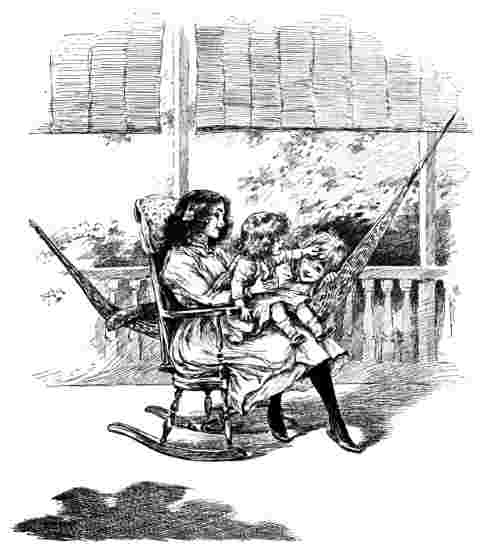 Betty sits on rocking chair with two children