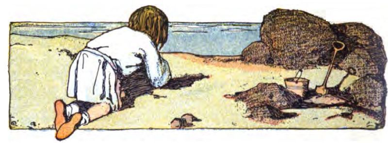 A brown-haired child is kneeling and playing in the sand, facing away from the viewer. They wear a light-colored long-sleeved shirt or tunic with a white skirt or apron. The sea lies ahead of the child. Rocks are to the right with a small pail and shovel in front of them.