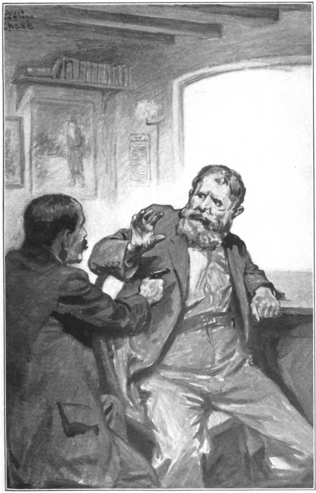 A man in a long black coat points a gun at a large seated man.