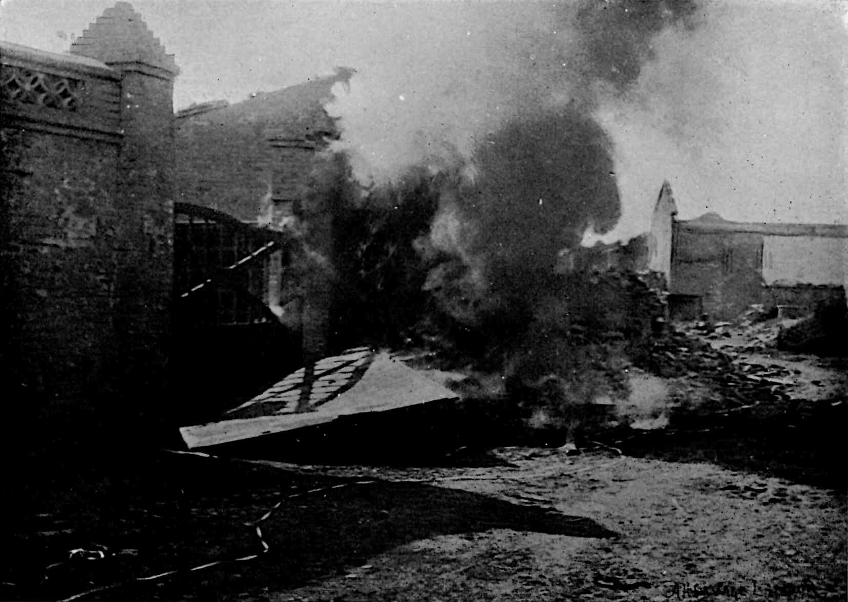 Buildings on sides with smoke from fire in middle