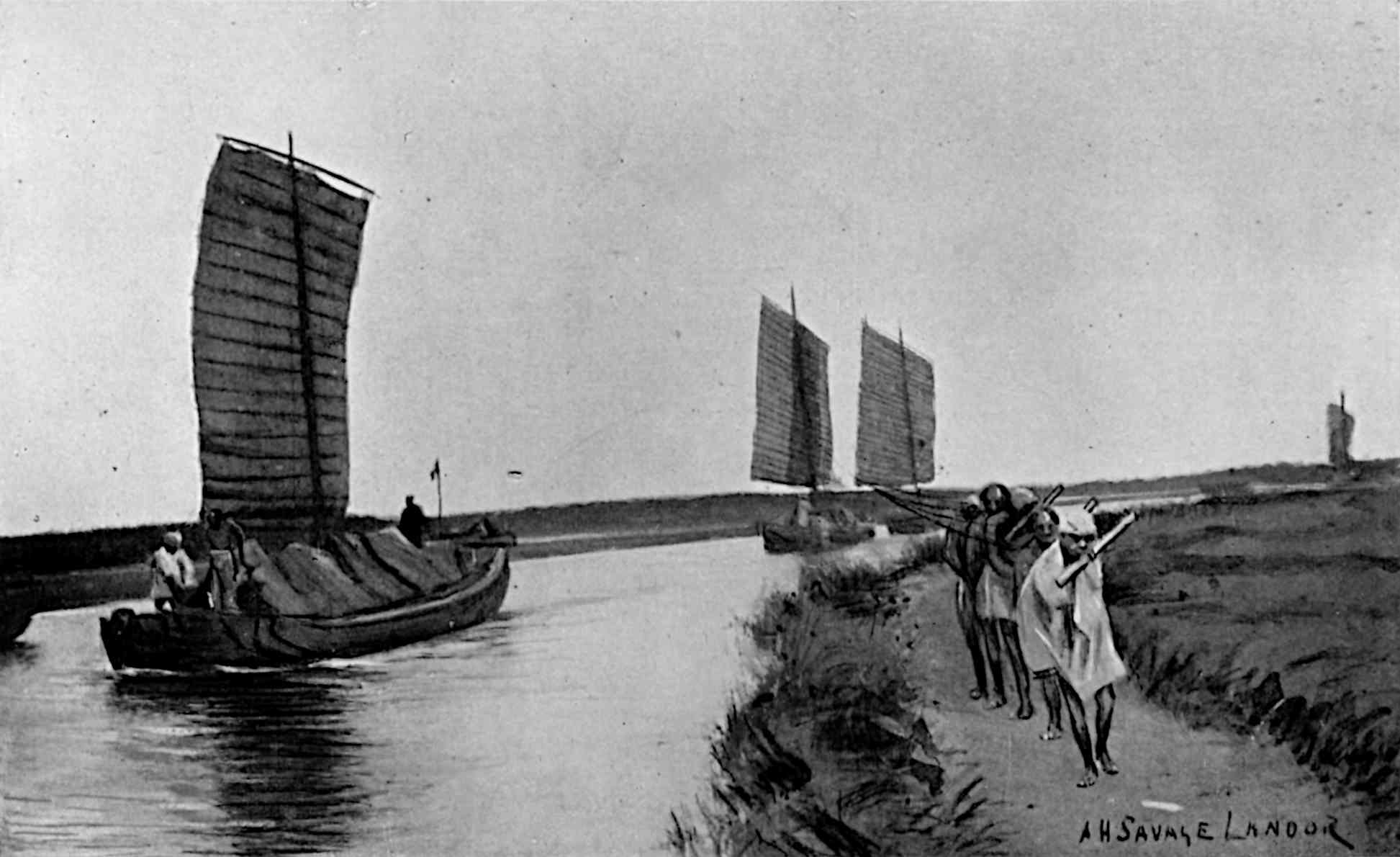 Boats on river, with people walking on trail to right