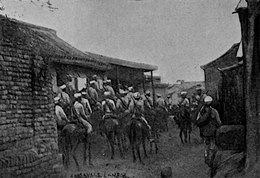 Many soldiers on horses outside of building