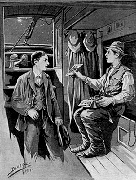 Two men in the cabin of a boat; one holding up a photo.