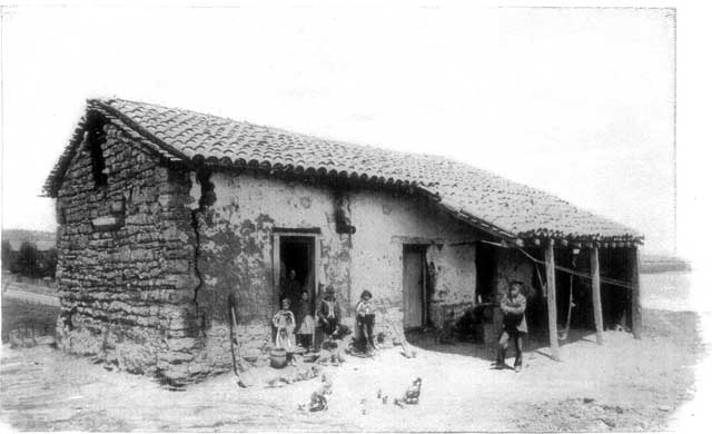 A MEXICAN HOUSE AND FAMILY.