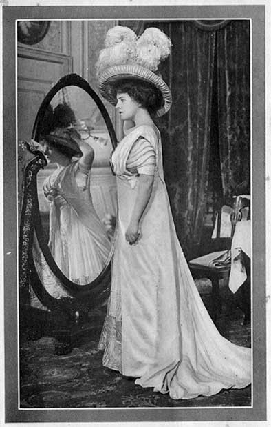PICKING UP A HAT, LAURA LOOKED AT HERSELF IN THE MIRROR.