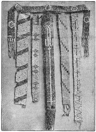 Fig. 2—Ancient Iroquois wampum belts.“The Onondagas retain the custody of the wampums of the Five Nations, and the keeper of the wampums, Thomas Webster, of the Snipe tribe, a consistent, thorough pagan, is their interpreter. Notwithstanding the claims made that the wampums can be read as a governing code of law, it is evident that they are simply monumental reminders of preserved traditions, without any literal details whatever. “The first [of this] group from left to right, represents a convention of the Six Nations at the adoption of the Tuscaroras into the league; the second, the Five Nations, upon seven strands, illustrates a treaty with seven Canadian tribes before the year 1600; the third signifies the guarded approach of strangers to the councils of the Five Nations (a guarded gate, with a long, white path leading to the inner gate, where the Five Nations are grouped, with the Onondagas in the center and a safe council house behind all); the fourth represents a treaty when but four of the Six Nations were represented, and the fifth embodies the pledge of seven Canadian christianized nations to abandon their crooked ways and keep an honest peace (having a cross for each tribe, and with a zigzag line below, to indicate that their ways had been crooked but would ever after be as sacred as the cross). Above this group is another, claiming to bear date about 1608, when Champlain joined the Algonquins against the Iroquois.”—Carrington, in Six Nations of New York, Extra Bulletin, Eleventh Census, pp. 33–34, 1892.