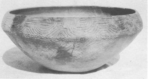 Pottery bowl showing carinated shoulder, bold incising, complicated stamping, and reed punctates typical of Lamar Bold Incised. Diameter, 16 inches.