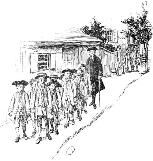 Boys walking through village