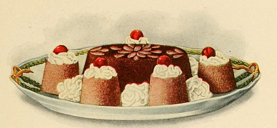 round chocolate cake  with almond decoration surrounded by smaller cakes topped with whipped cream and a cherry