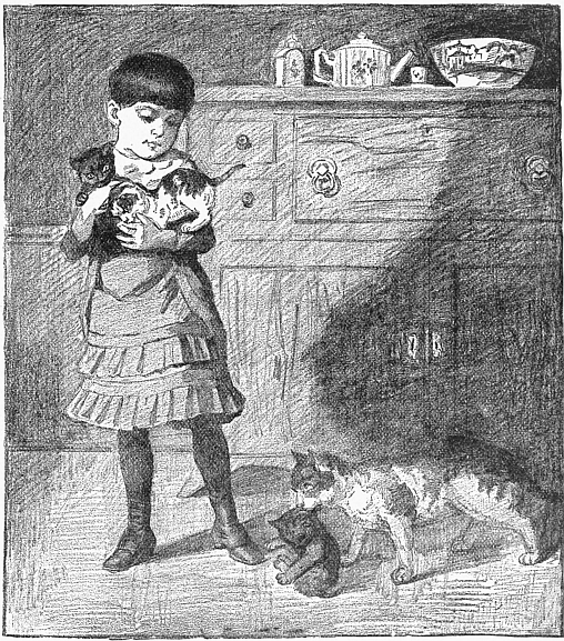 child holding kitten