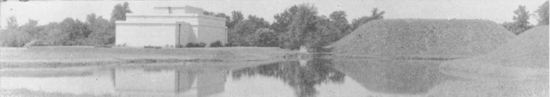 View of mound, lake, and museum