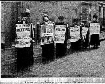 SUFFRAGETTES IN LONDON ADVERTISING A MEETING