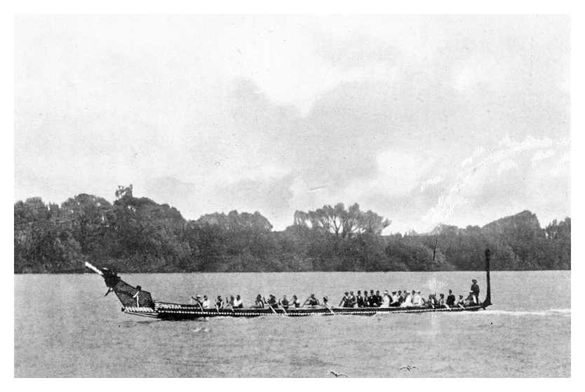 MAORIS CONVEYING GUESTS IN A CANOE