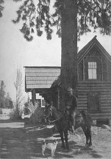 "Bob" Watson, Tahoe guide, at home, with his dog Skookum John