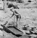 PLACER GOLD MINING. Washing with Cradle.
