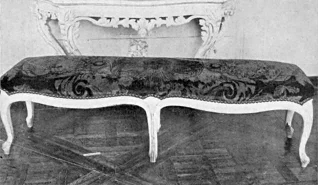 A BANQUETTE OF THE LOUIS XV. PERIOD COVERED WITH NEEDLEWORK