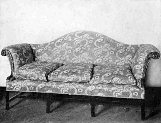 A CHINESE CHIPPENDALE SOFA COVERED WITH CHINTZ