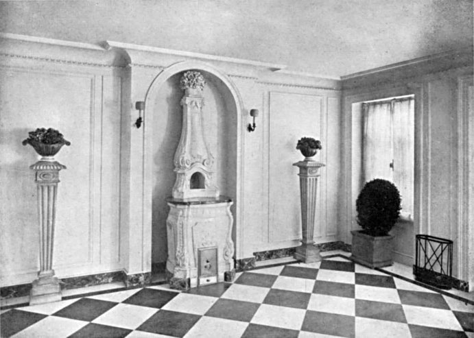 A CREAM-COLORED PORCELAIN STOVE IN A NEW YORK HOUSE