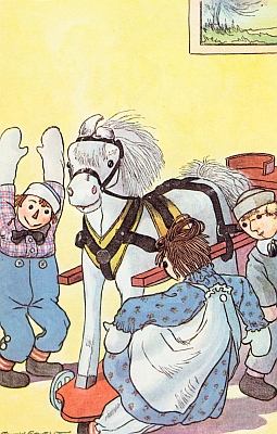 The wooden horse rolled over Raggedy Ann's foot