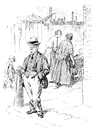Street scene--Man on corner, two women and a child.