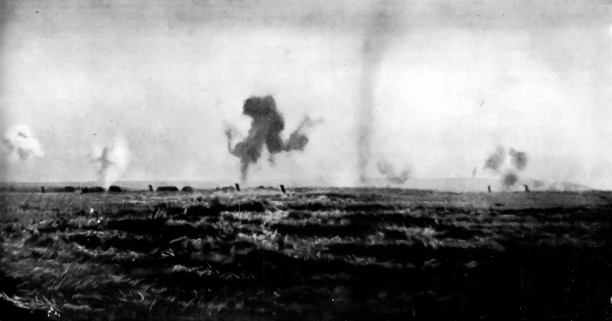 "SIX GERMAN SHELLS TO EVERY FRENCH SOLDIER"--SHRAPNEL AND HIGH-EXPLOSIVE BOMBS BURSTING IN THE OPEN: A PANORAMIC PHOTOGRAPH TAKEN DURING A BATTLE IN THE ARGONNE. (right half)