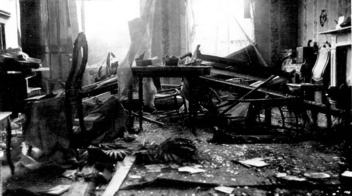 HOME AFTER A GERMAN VISITATION: A ROOM IN A HOUSE AT NIEUPORT AFTER A SHELL HAD BURST.
