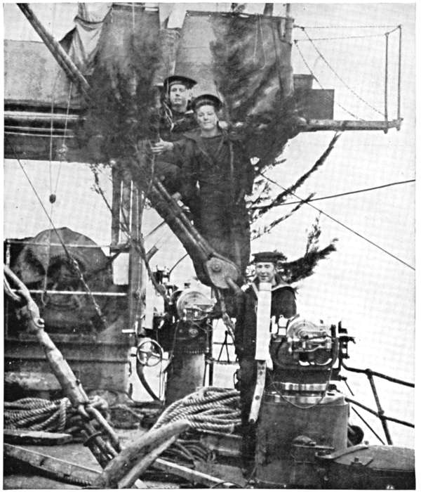 CHRISTMAS DECORATIONS ON A BRITISH WAR-SHIP: EVERGREENS FOR THE MASTHEAD.