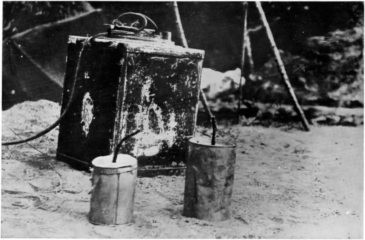 WEAPONS OF GREY "MOLES," AT TSING-TAU: A LAND-MINE AND
EMERGENCY HAND-GRENADES CAPTURED FROM THE GERMANS.