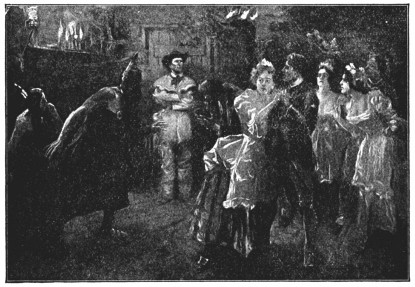A man in frontier clothing looks on at a group of dancers.