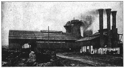 A photograph of a factory exterior.