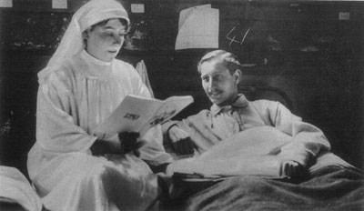 Nurse reading to soldier