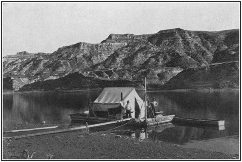 Fig. 47.: American Museum Expedition on the Red Deer River. Fossils secured along the banks were packed and loaded aboard the large scow and floated down the river to the railway station.